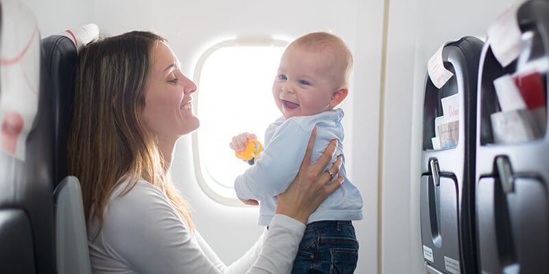 happy baby on aeroplane