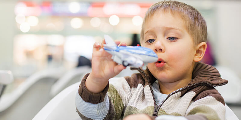 little boy playing with toy