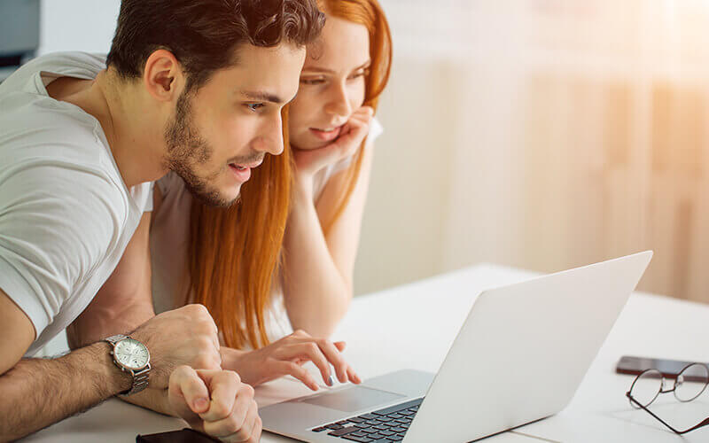 couple looking on laptop